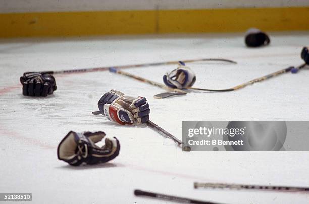 Hockey equipment litters the ice after a fight, November 1997.