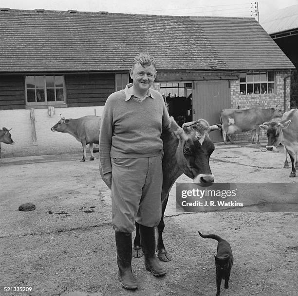 British Conservative politician, Quintin Hogg, Baron Hailsham of St Marylebone on his dairy farm at Carters Corner Place, Carters Corner, Nr...