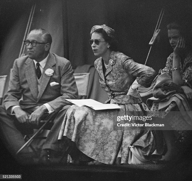 Queen Elizabeth II watching Prince Philip, Duke of Edinburgh during a cricket match at Highclere Castle, Highclere, Hampshire, 3rd August 1958.