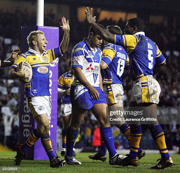 Rob Burrow of Leeds celebrates his try with Marcus Bai during the Carnegie World Club Challenge match between Leeds Rhinos and the Canterbury...