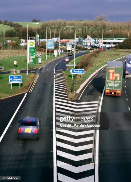 exit to service station on m6 highway - garage stock pictures, royalty-free photos & images