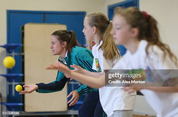 Lydia Greenway of England with children from Houghton Primary School during a media event to coincide with the launch of the book, "The Girls Of...