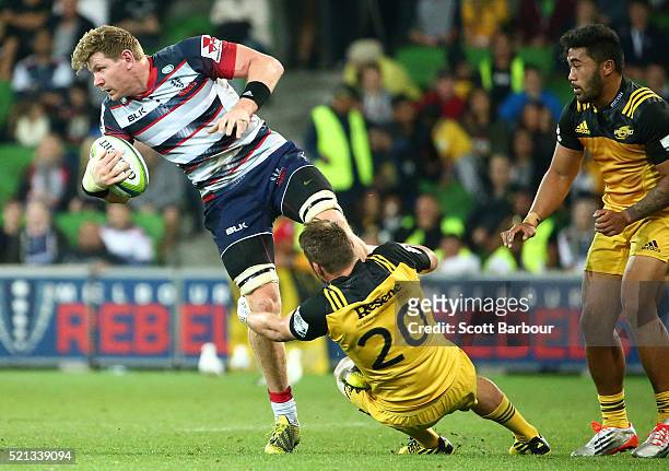 Adam Thomson of the Rebels runs with the ball during the round eight Super Rugby match between the Rebels and the Hurricanes at AAMI Park on April...