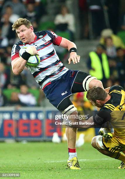 Adam Thomson of the Rebels runs with the ball during the round eight Super Rugby match between the Rebels and the Hurricanes at AAMI Park on April...