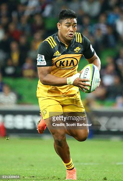 Julian Savea of the Hurricanes runs with the ball during the round eight Super Rugby match between the Rebels and the Hurricanes at AAMI Park on...