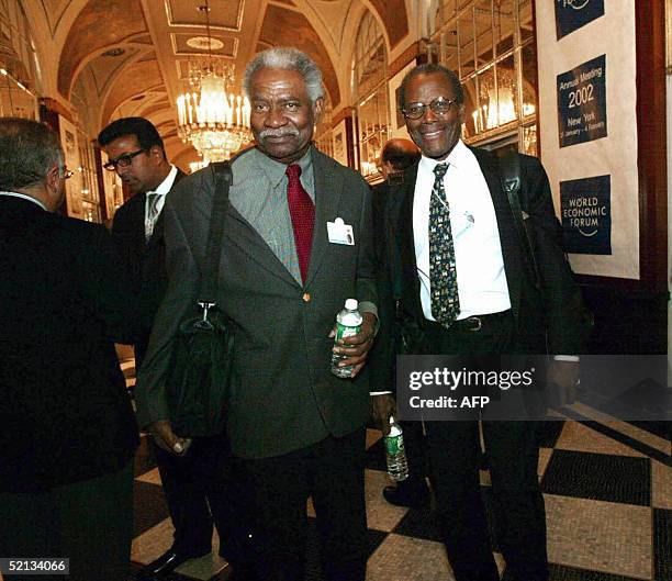 This 31 January 2002 file photo shows US actors Ossie Davis and Sidney Poitier at the World Economic Forum held in New York's Waldorf-Astoria hotel....