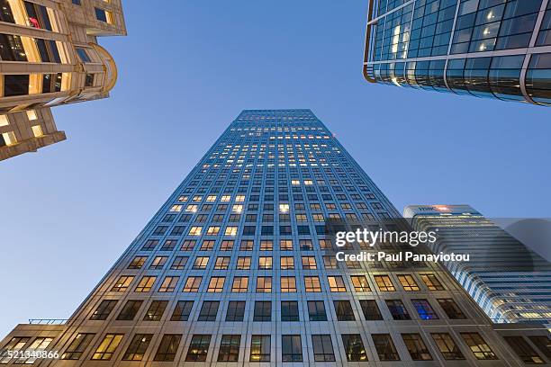 office buildings in london's canary wharf - canada tower stock pictures, royalty-free photos & images