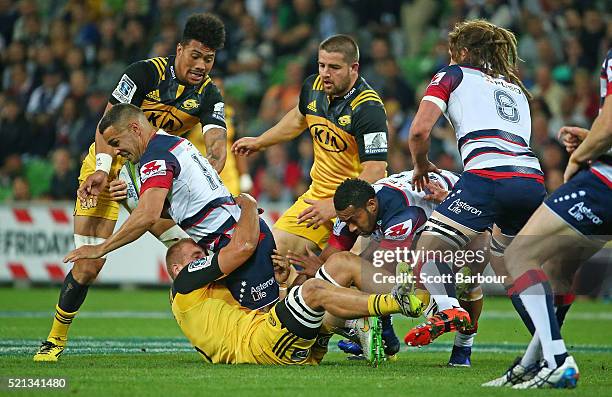 Tamati Ellison of the Rebels runs with the ball during the round eight Super Rugby match between the Rebels and the Hurricanes at AAMI Park on April...