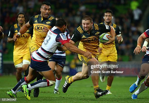 Dane Coles of the Hurricanes runs with the ball during the round eight Super Rugby match between the Rebels and the Hurricanes at AAMI Park on April...