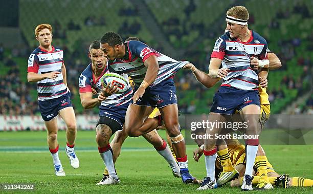 Sefa Naivalu of the Rebels is tackled during the round eight Super Rugby match between the Rebels and the Hurricanes at AAMI Park on April 15, 2016...