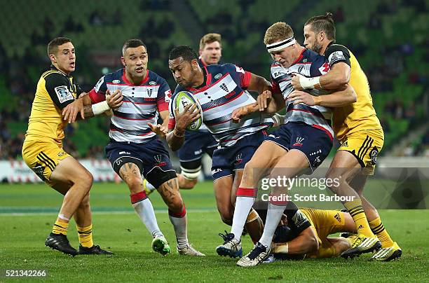 Sefa Naivalu of the Rebels is tackled during the round eight Super Rugby match between the Rebels and the Hurricanes at AAMI Park on April 15, 2016...