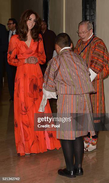 Catherine, Duchess of Cambridge is presented a silk scarf by Ugyen Michael Wangchukat at a reception celebrating UK and Bhutanese friendship and...