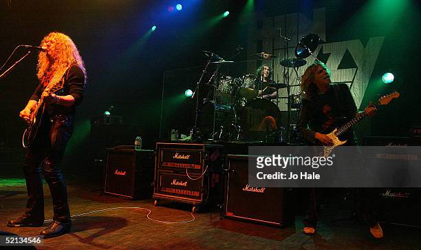 John Sykes original guitarist and Scott Gorham vocalist and Martin Lee drummer of rock band Thin Lizzy performs on stage during London date of their...