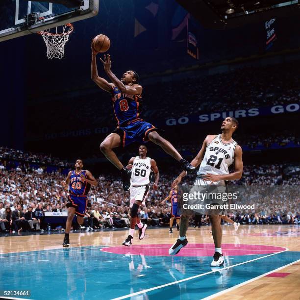 Latrell Sprewell of the New York Knicks goes for a dunk against the San Antonio Spurs during the NBA game in 1999 at the Alamo Dome in San Antonio,...