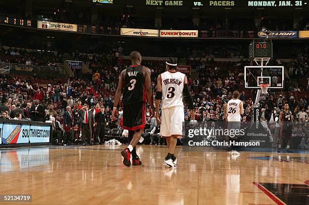Allen Iverson of the Philadelphia 76ers walks with Dwyane Wade of the Miami Heat during the game on January 24, 2005 at the Wachovia Center in...