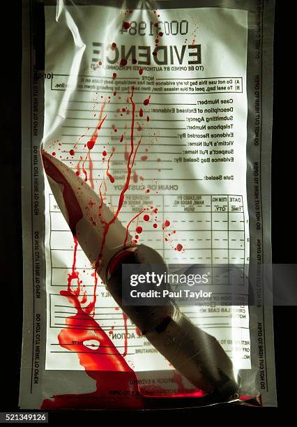 evidence in plastic bags - bloody knife stock pictures, royalty-free photos & images