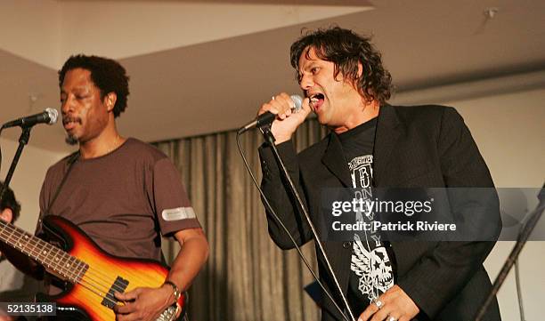 Singer Doug Williams performs with singer Jon Stevens at the "Gift Of Life" Charity event at the New South Wales League Club January 4, 2005 in...