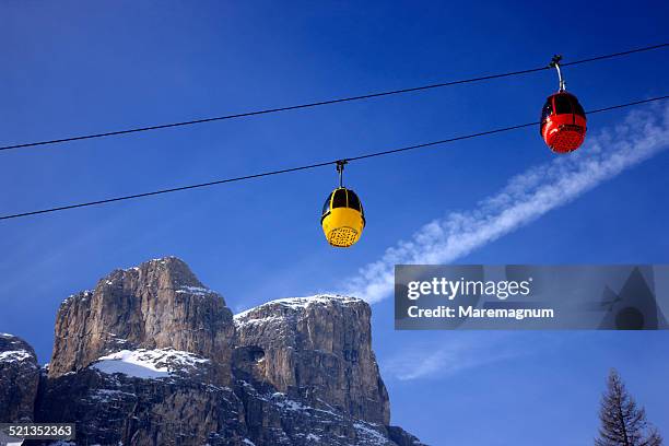 on the road to the gardena pass - overhead cable car stock pictures, royalty-free photos & images