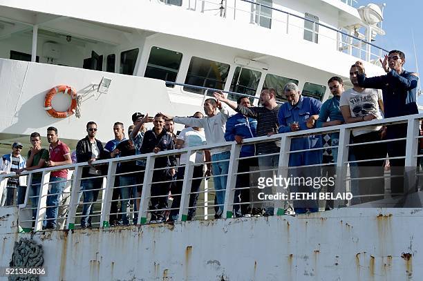 Residents of the city of Sfax shout slogans towards police on April 15, 2016 as reinforcments take a boat to the island of Kerkennah where clashes...