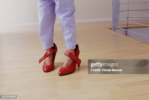 child wearing high heels - kid in big shoes stock pictures, royalty-free photos & images