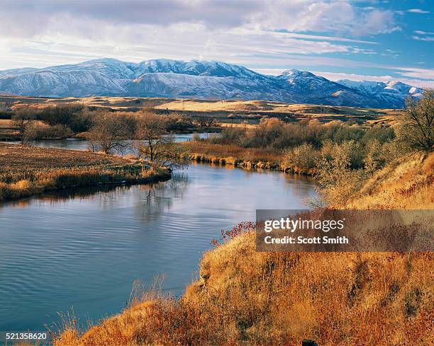 bear river in late autumn with bannock range in distance - idaho stock-fotos und bilder