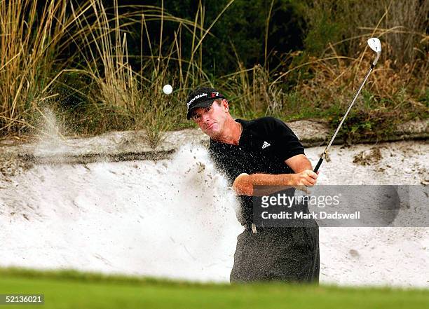 Peter Lonard of Australia hits out of a bunker on the ninth hole during day three of the 2005 Heineken Classic at the Royal Melbourne Golf Club on...