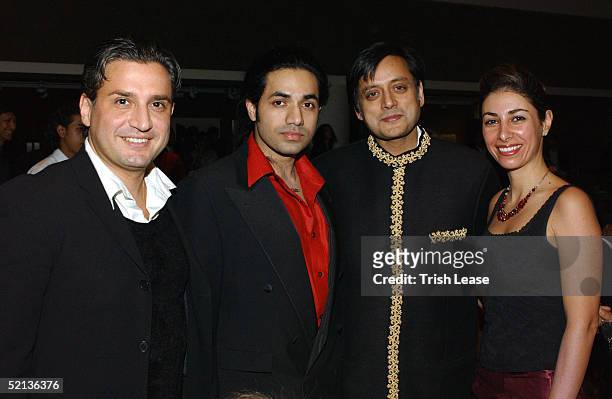 Designer Anand Jon stands with friends at the Amba Project Benefit For Tsunami Relief fashion show during Olympus Fashion Week at Christie's February...