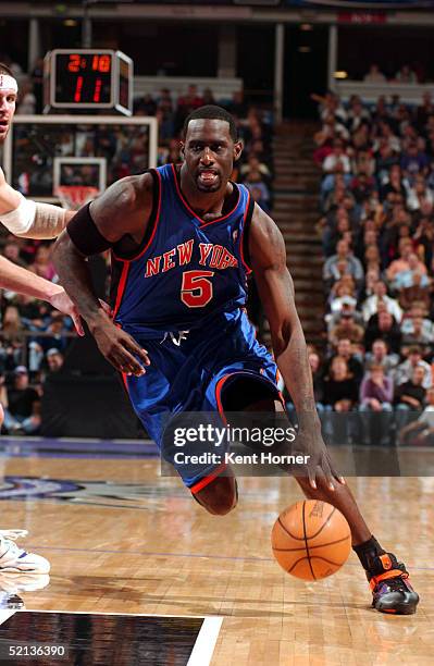 Tim Thomas of the New York Knicks drives to the basket against the Sacramento Kings February 04, 2005 at the Arco Arena in Sacramento, California....