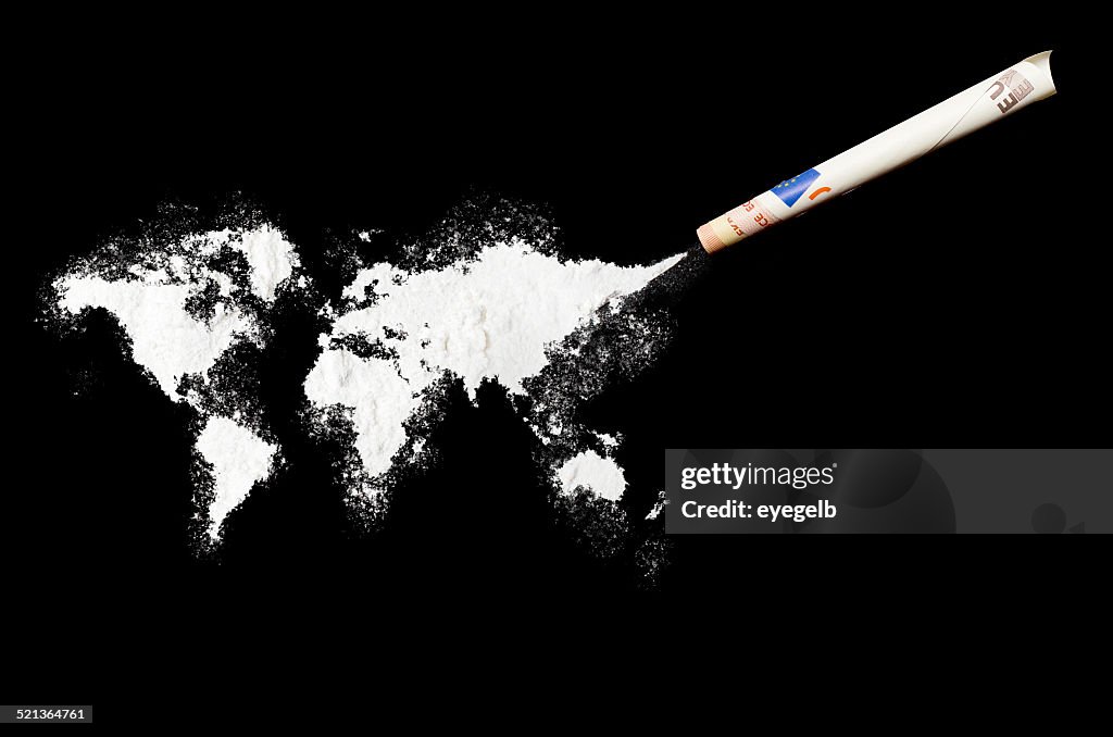Powder drug like cocaine in the shape of the world