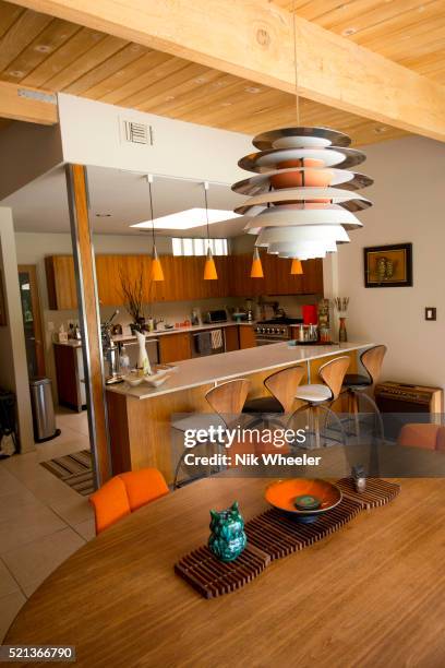 Interior furnishings of dining and sitting room of a home decorated in mid century style in the desert resort town of Palm Springs, in the Coachella...