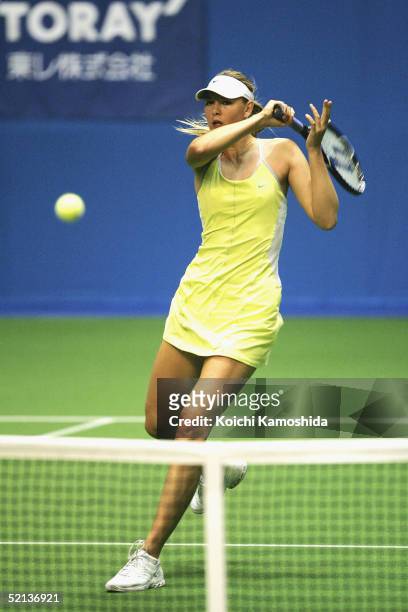 Maria Sharapova of Russia returns the ball during her Semifinal women's single match against Shinobu Asagoe of Japan at the Pan Pacific Open tennis...