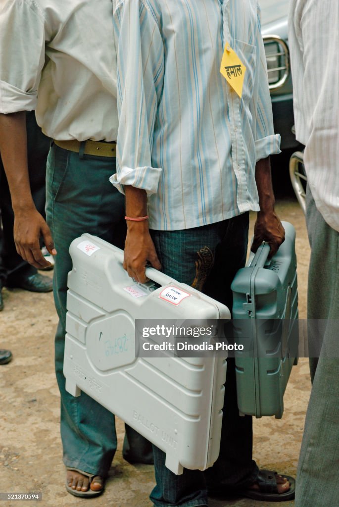 Polling officer carry ballot box Bombay, Mumbai, Maharashtra, India