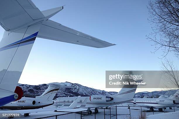 Privately owned jet planes are parked on the apron of Aspen airport during the Christmas and New Years holiday in the ski resort town of Aspen in the...