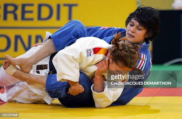 France's Marie Pasquet fights with Spanish European champion Sara Alvarez during the qualifications second round of the women's -63 kg category of...