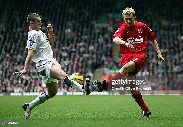 Sami Hyypia of Liverpool attempts to shoot past Lee Clark of Fulham during the Barclays Premiership match between Liverpool and Fulham at Anfield on...