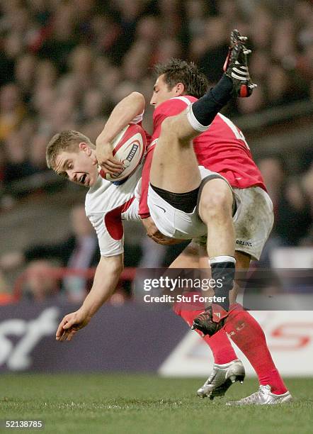 England debutant Mathew Tait is tackled by Gavin Henson during the RBS Six Nations game between Wales and England on February 5, 2005 in Cardiff,...