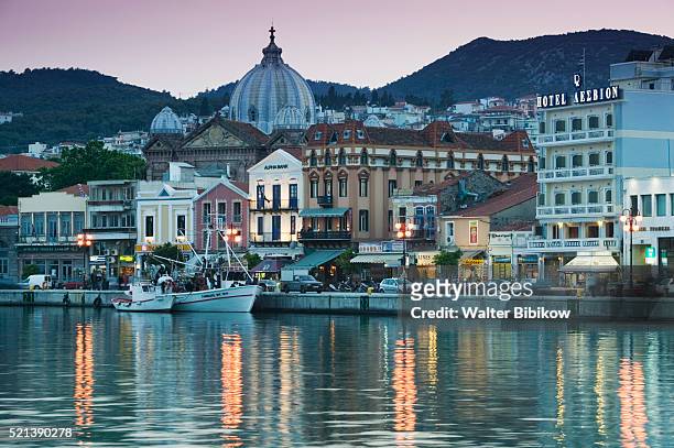 waterfront view of southern harbor and agios therapon church - mytilini stockfoto's en -beelden