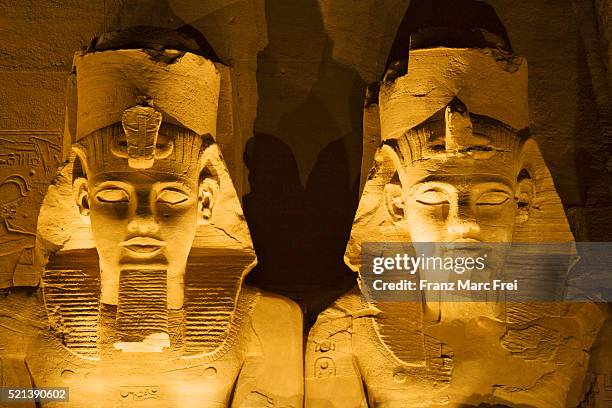 detail of seated colossi of ramesses ii at abu simbel temple - colossus stock pictures, royalty-free photos & images