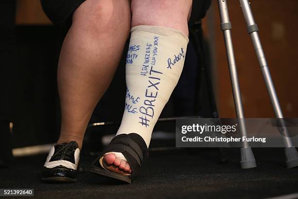 Vote leave supporter has "#BREXIT' written on her plaster cast as she listens to London Mayor Boris Johnson address suporters during a rally for the...