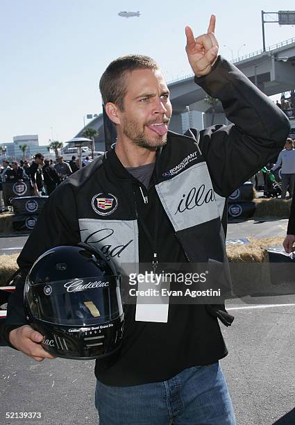 Actor Paul Walker cheers after racing in the 3rd Annual Cadillac Super Bowl Grand Prix at the CSX Parking Lot on February 5, 2005 in Jacksonville,...