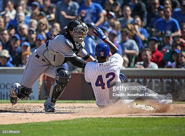 Tony Wolters of the Colorado Rockies tags out Jorge Soler of the Chicago Cubs at the plate in the 5th inning at Wrigley Field on April 15, 2016 in...