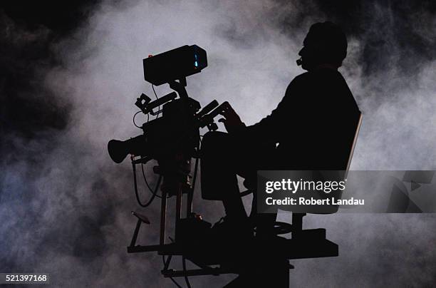 smoke surrounding cameraman - cameraman stock pictures, royalty-free photos & images