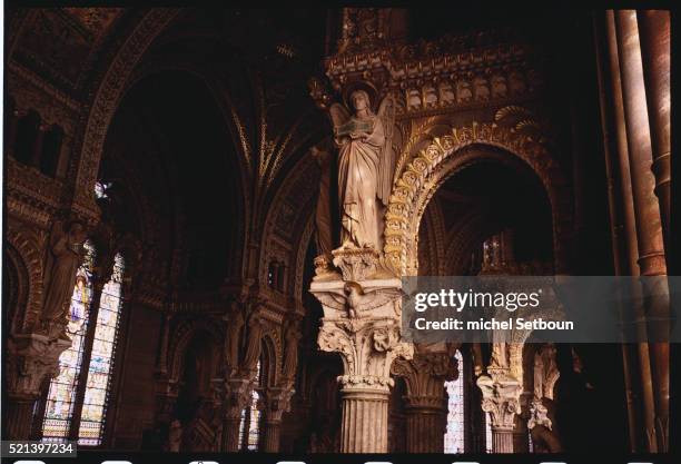 architectural ornamentation with angel in notre dame de fourviere - arts décoratifs photos et images de collection