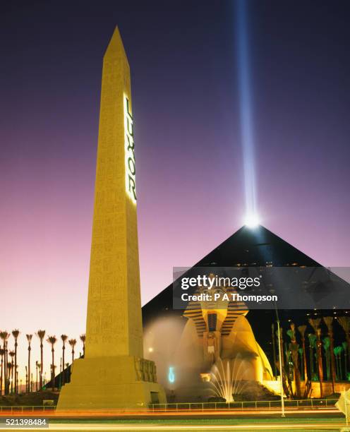 the luxor hotel and casino at dusk - las vegas pyramid hotel stock pictures, royalty-free photos & images
