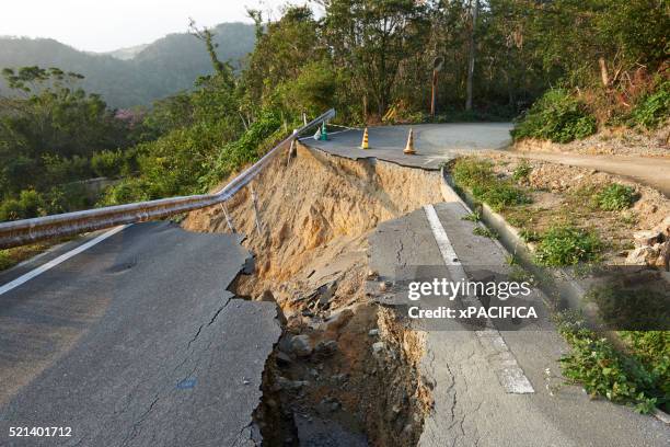 landslide damage caused by typhoons in okinawa - erdrutsch stock-fotos und bilder