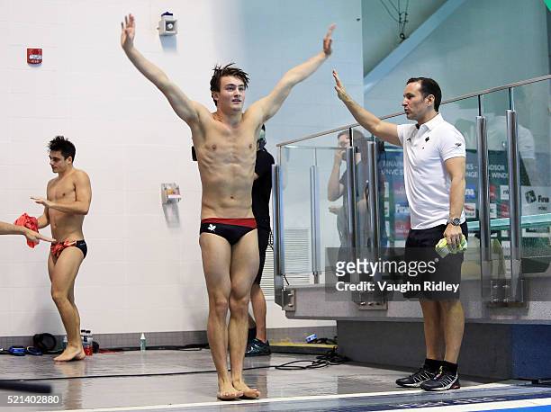 Philippe Gagne of Canada practices a dive with coach Aaron Dziver during the Men's 3m Synchro Final during Day One of the FINA/NVC Diving World...