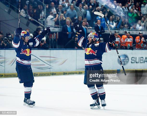 Jeremey Dehner of Red Bull Muenchen celebrates scoring the winning goal during the DEL Ice Hockey Playoffs Final Game One between EHC Red Bull...