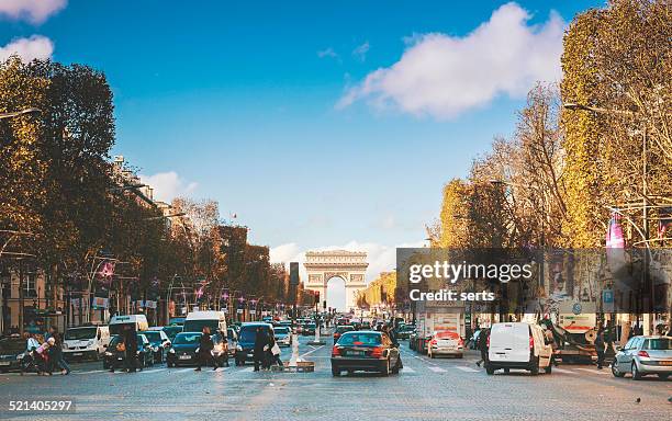 traffic in champs elysees street - champs elysees quarter stock pictures, royalty-free photos & images
