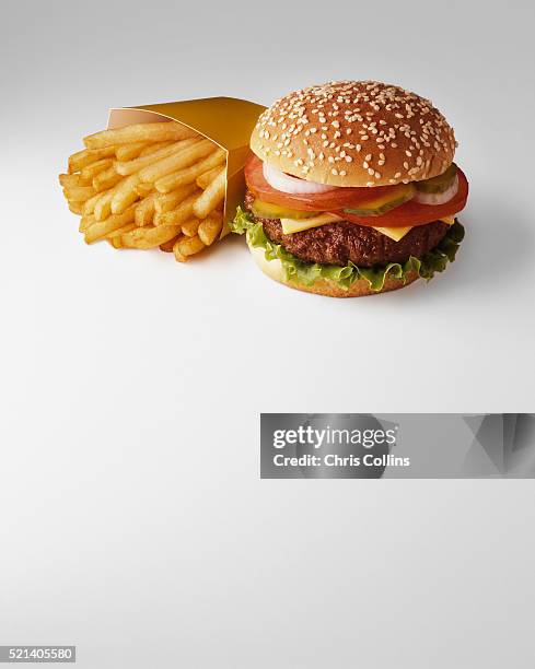 french fries and hamburger - burger stock-fotos und bilder