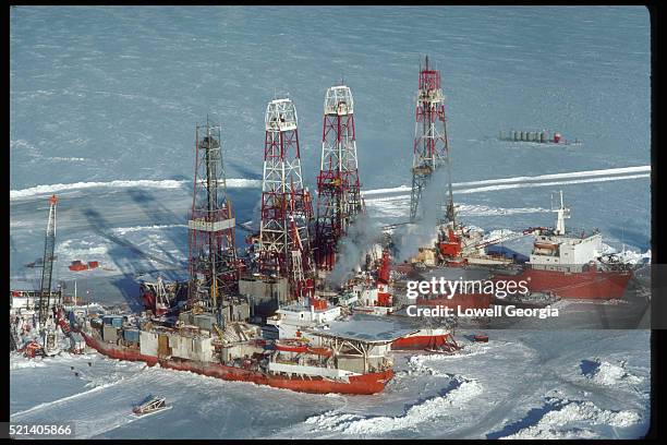 oil drilling ships and towers - arctic oil stock-fotos und bilder